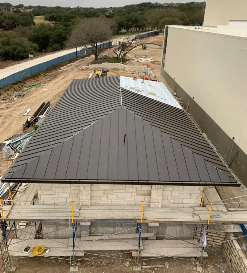 Metal roof new construction with scaffolding in Carney