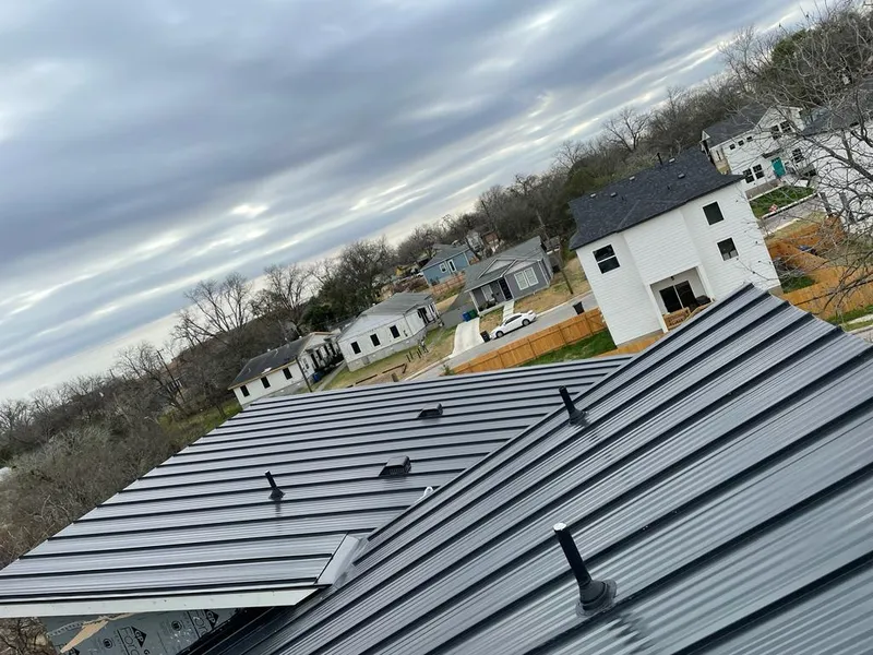 Standing seam metal roof panels with vents for Skylight Repair in Carney